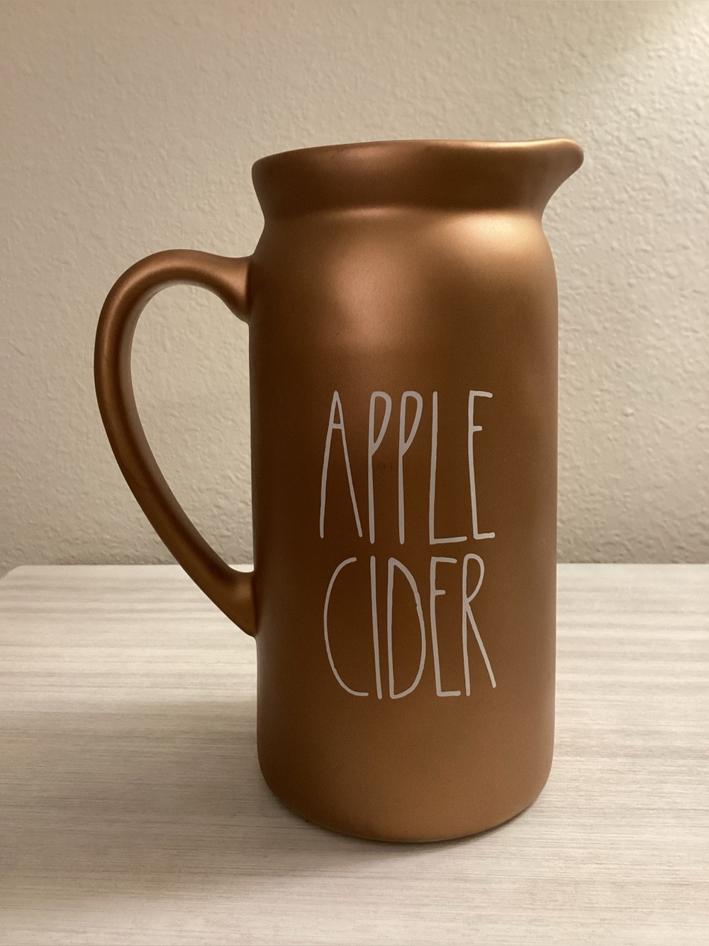 Rae Dunn Copper Colored Pitcher featuring the words "Apple Cider" - IEC